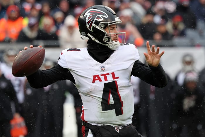 Dec 31, 2023; Chicago, Illinois, USA; Atlanta Falcons quarterback Taylor Heinicke (4) drops back to pass against the Chicago Bears during the first half at Soldier Field.